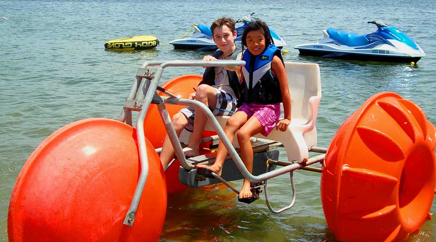 Orange Aqua-Cycle™ Water Trike at Campland on the Bay in San Diego for their recreation water equipment for a rental business